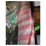 Roll of pink and white striped  plastic unknown