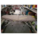 Portable ironing board. Folds down for easy
