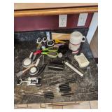 Assorted kitchen utensils and thermos