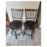 2 barstools one needs reupholstered
