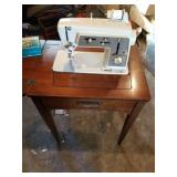 Singer touch and sew sewing machine in cabinet