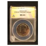 1976-D MS65 Struck Through Grease Half Dollar