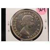 1958 Canada "Totem Poll" Silver Dollar
