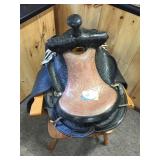 Western leather saddle with stirrups