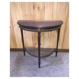 Antique half table with rattan shelf