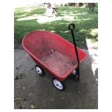 Red utility yard cart, metal trashcan and blue Red utility yard cart, metal trashcan and blue