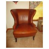 TRANSITIONAL BROWN LATHER WING CHAIR WITH ANTIQUE