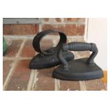 PAIR OF CAST IRON HAND IRONS