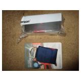 KEYRING & UNOPENED HEARING AID