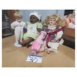 4 Assorted Dolls