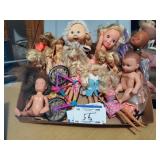 Assorted Dolls and Doll Bicycle