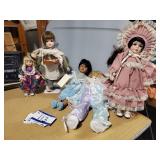 Various porcelain dolls