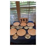 6 non matching plates and 12 tin saucers