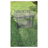 Wrought iron serving cart on wheels