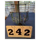 10 necklaces (turquoise) and stand