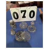 6 glass items with a metal trim
