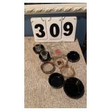 9 ash trays and 2 shot glasses