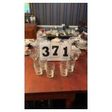4 stemmed wine glasses and 10 small glasses