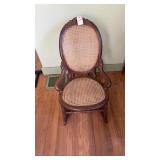 antique Victorian-style wooden rocking chair