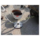 SMALL CST IRON POT ON A STEEL WHEEL FOR PLANT SMALL CST IRON POT ON A STEEL WHEEL FOR PLANT