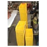 SEVERAL YELLOW ORGANIZING TRAYS