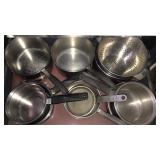 assorted pots, pans, strainers