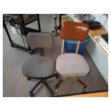 Two rolling office chairs