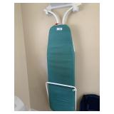 Ironing board with holder