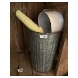 galvanized trash can with contents