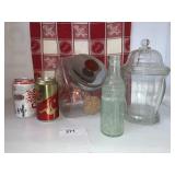 Candy jars, Coke cans, and bottle Candy jars, Coke cans, and bottle