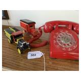 Red rotary phone, 2 Coke trucks