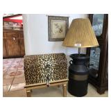 Lamp, wall hanging and animal print chest