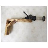 Powder Measurer mounted on Piece of Wood