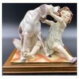 G. Armani Dog Licking Girl Sculpture