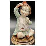 G. Armani Child Combing Hair Statue