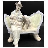 Man With His Dogs Sitting on Chair Figurine