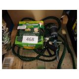2 garden hoses and sprinkler
