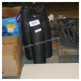 3 stacks of black planters