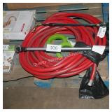 red water hose and sprayer