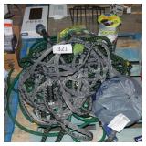 lot of water hoses and sprayers