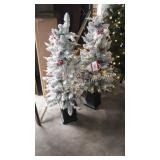 2 prelit  potted trees