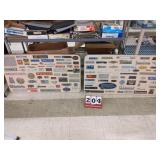 Old metal signs displayed on old table tops