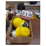 Five hard hats and two safety goggles