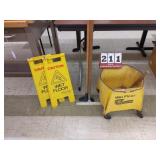 Commercial mop bucket and floor caution signs