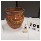 Terracotta pot with decorative sash