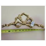 Brass ribbon wall art