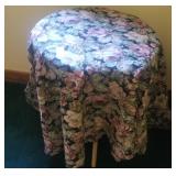 3 legged particle board table with upholstery