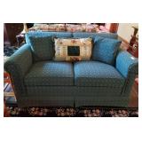 Ethan Allen loveseat green print with pillows