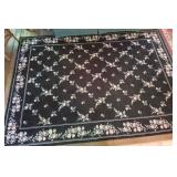 Large Couristan area rug 5 ft x 7 ft black with