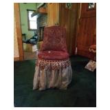 Upholstered vanity chair with tassels